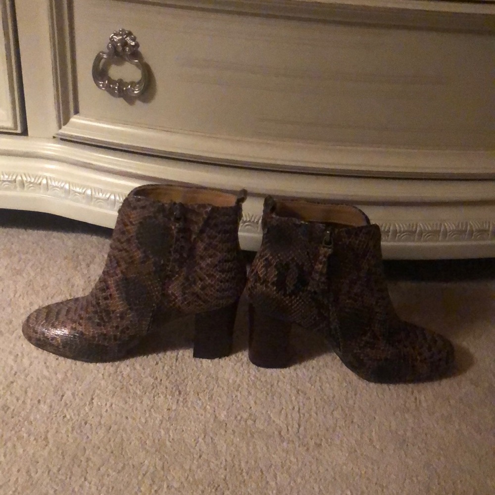 Women booties . New without tag.Lucca Lane snake skin brown. Never been worn.